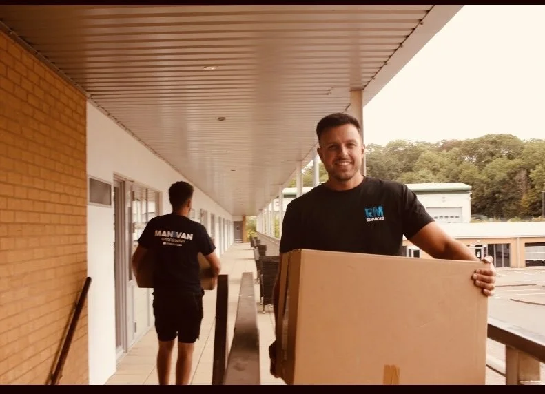 RM Removals carrying boxes on a house move in Gloucester